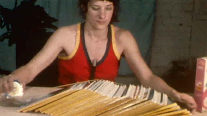 Andrea Callard measures her stack of National Geographic magazines.