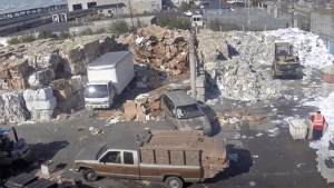 Individuals collect old corrugated cardboard and sell it for cash.