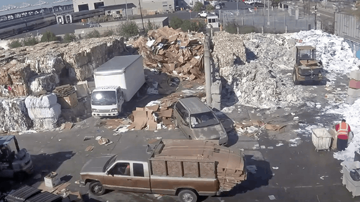 Individuals collect old corrugated cardboard and sell it for cash.