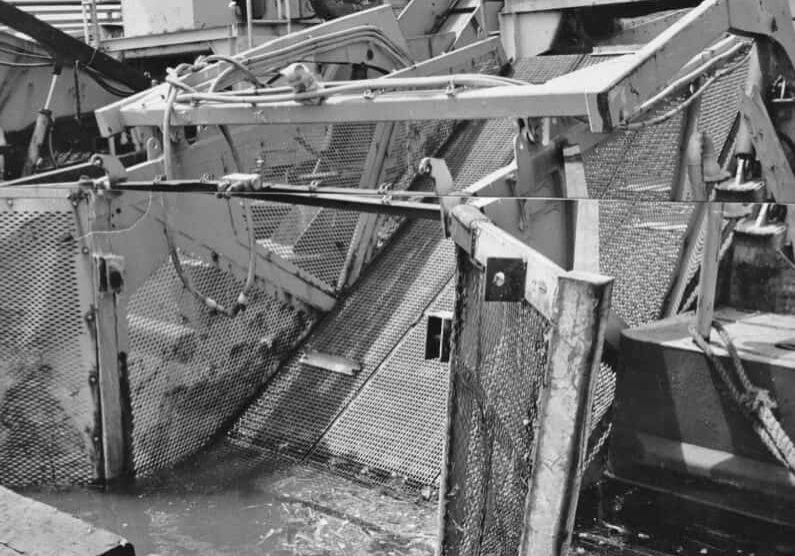 A boat for skimming litter blown from barges from the waters.